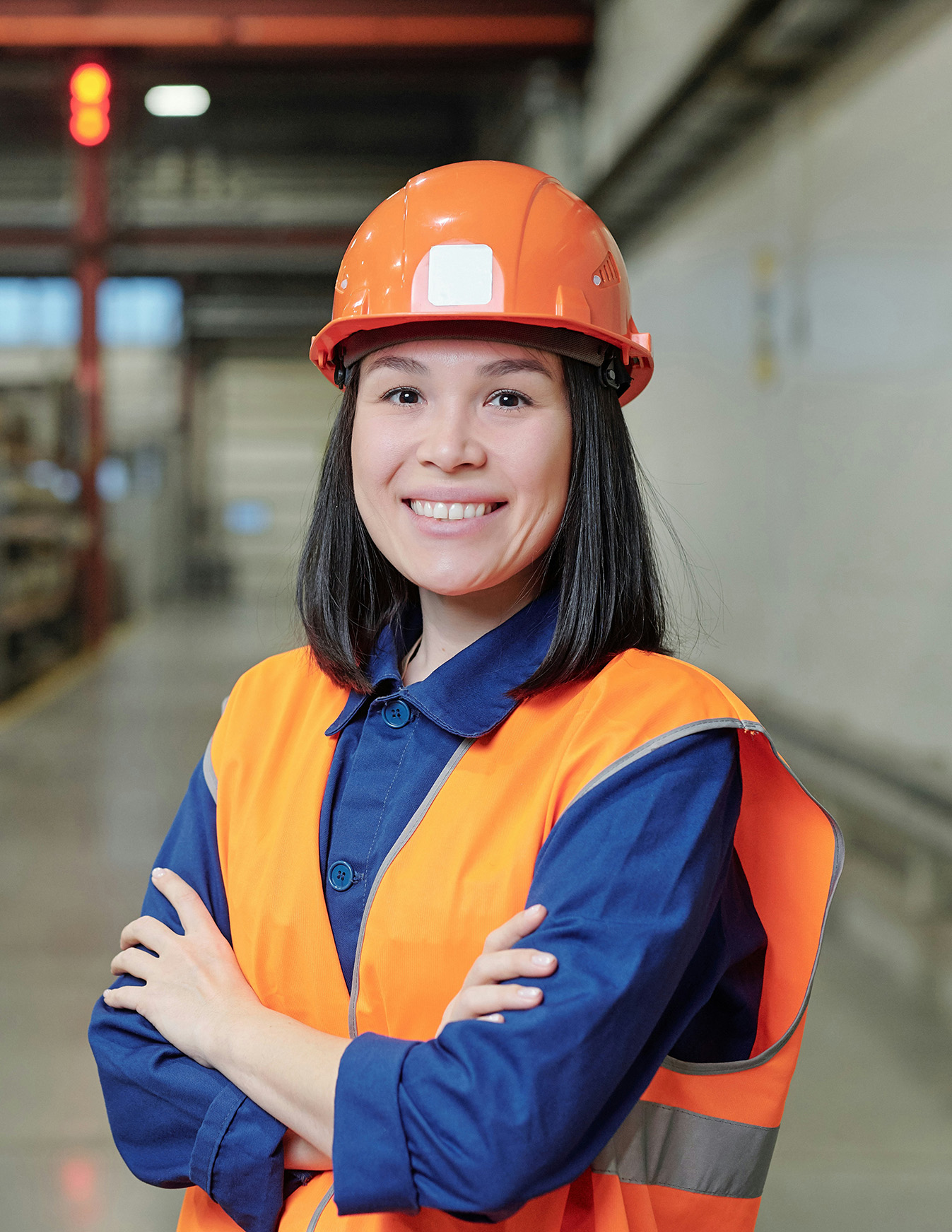 Worker in a hard hat on a production site